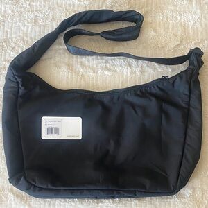 Away sleek black crossbody bag.